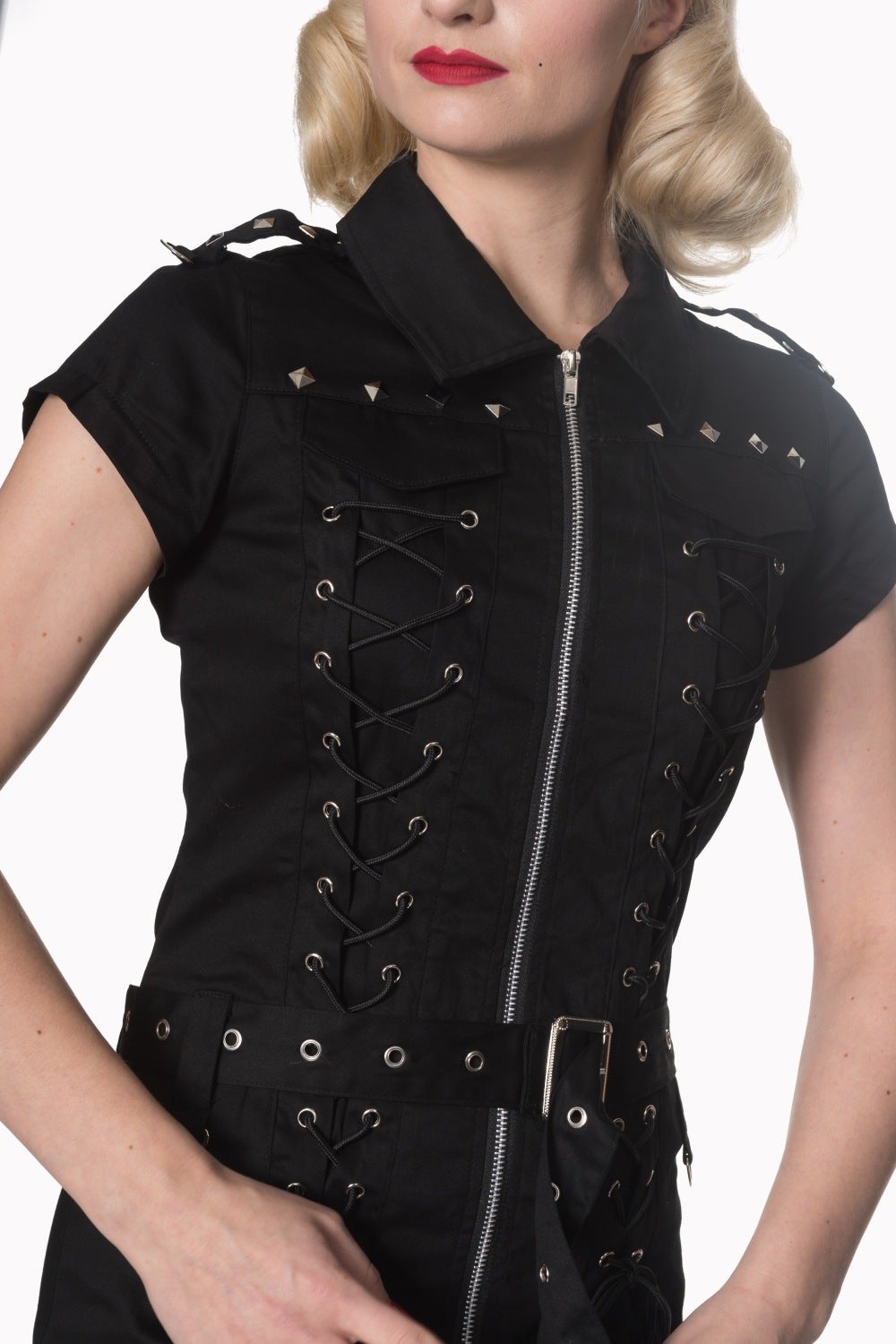 Model wearing black mini zip up dress with corset detailing