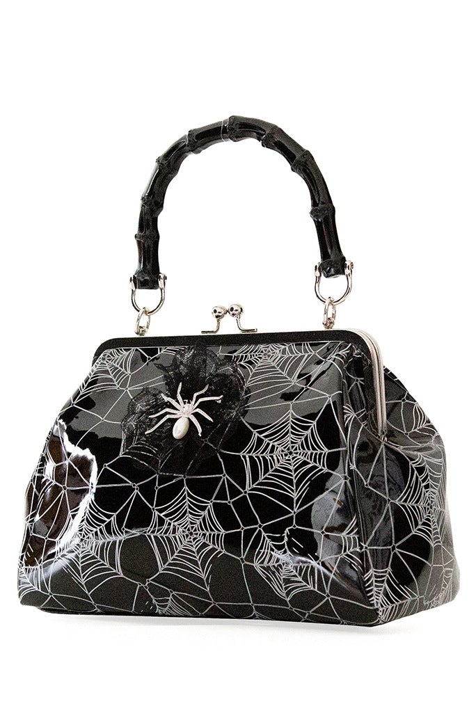 Black patent handbag with spider web print and spider detail