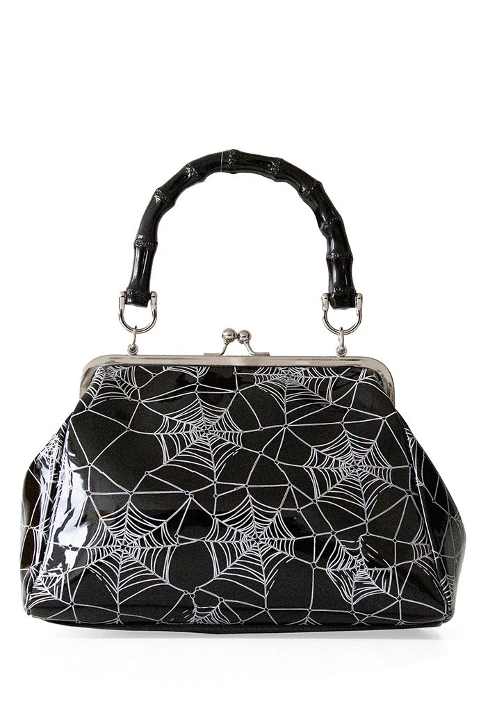Black patent handbag with spider web print and spider detail