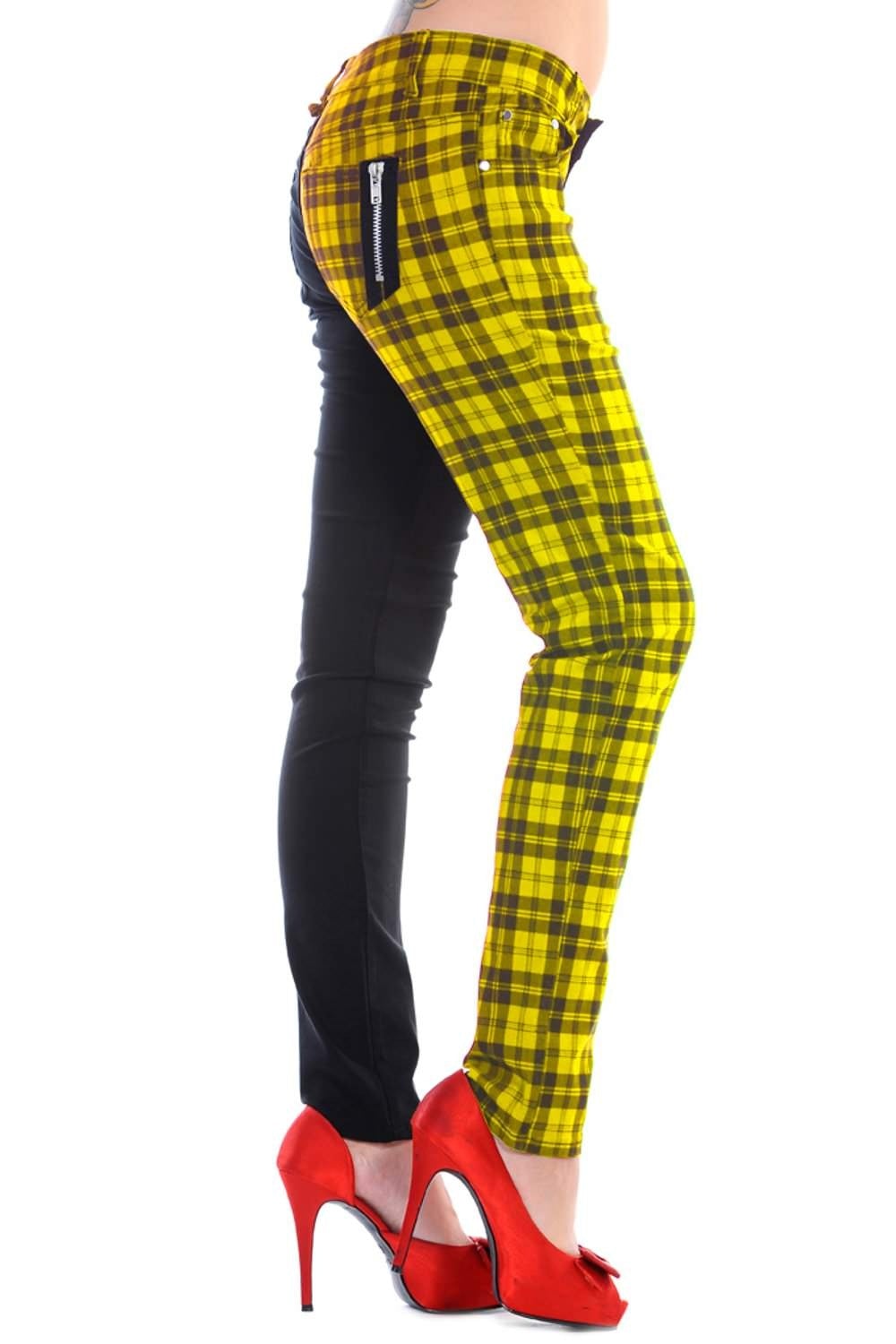 Yellow tartan check trousers with one leg black, low rise. 