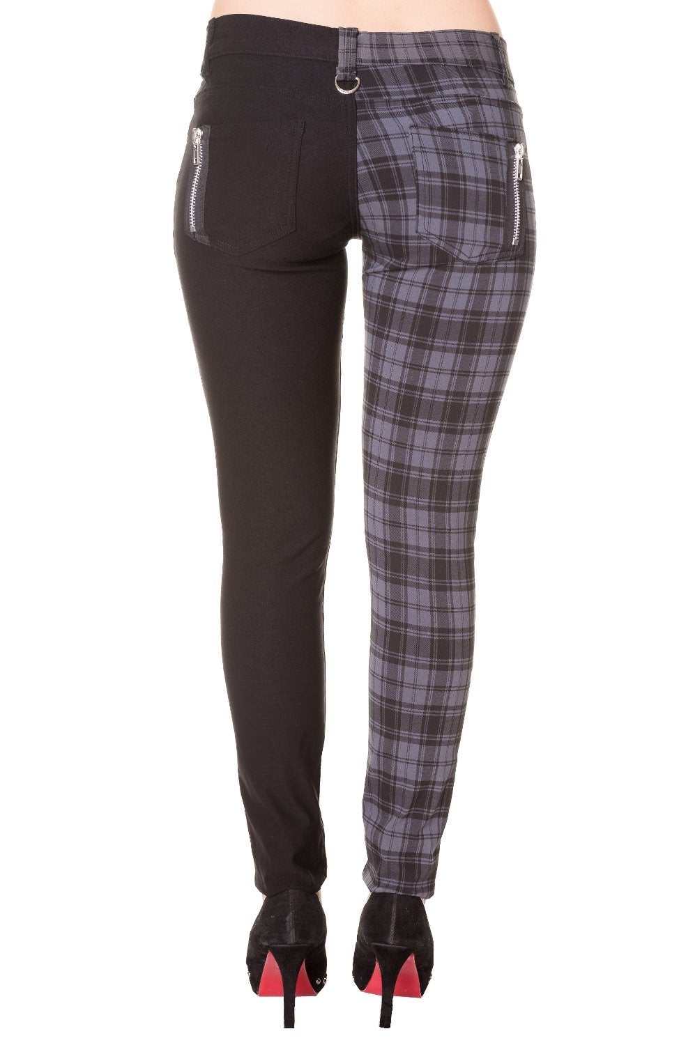 Grey tartan check trousers with one leg black, low rise. 