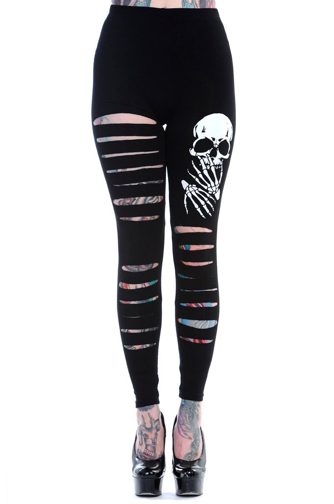 Black high waisted leggings with rips on both legs and skull print on left thigh