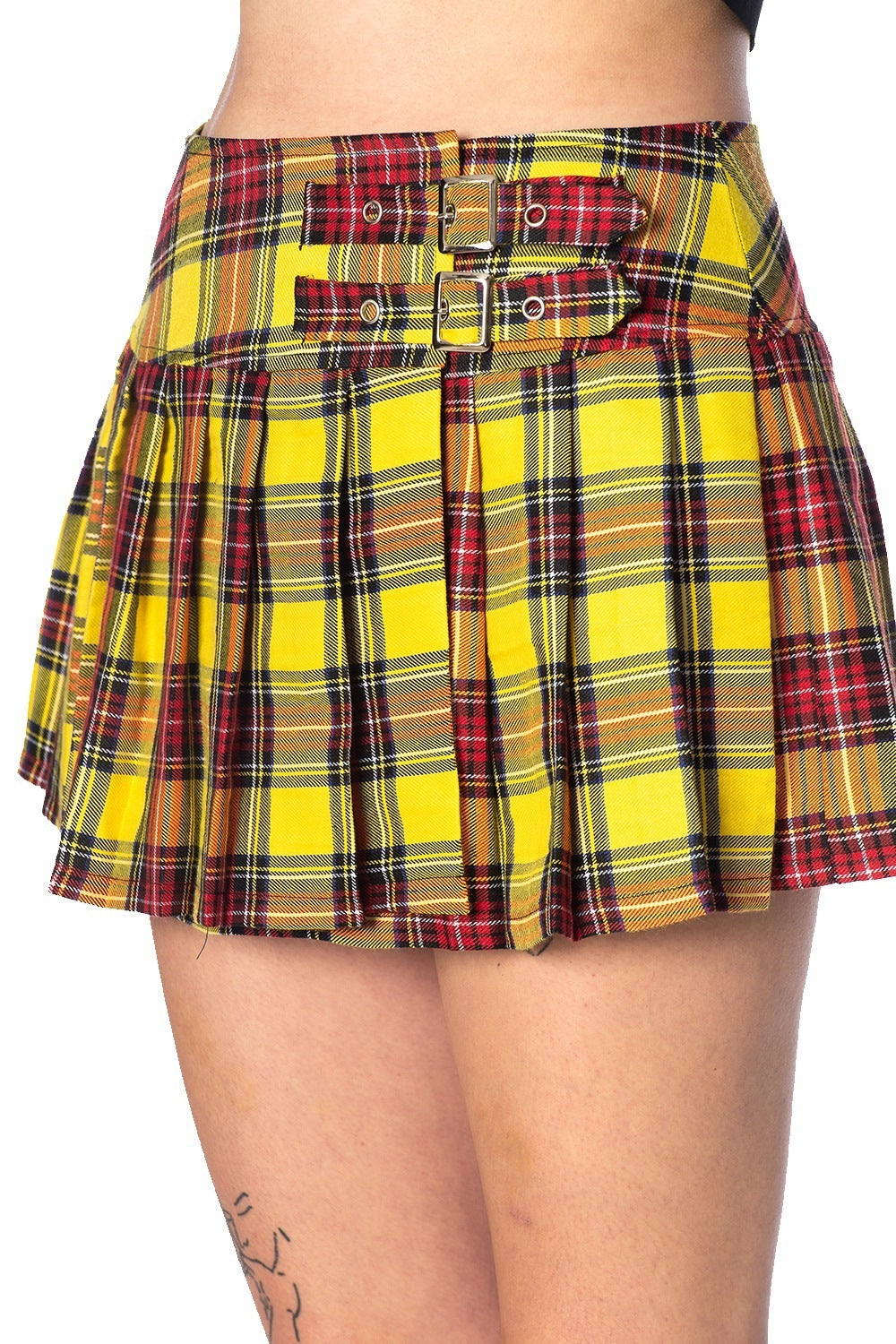 Close up shot of red and yellow tartan mini skirt with buckle features 