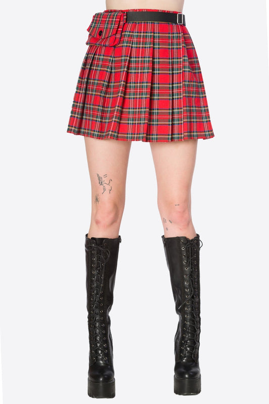 Model wears high waisted red tartan skirt with matching belt pouch.