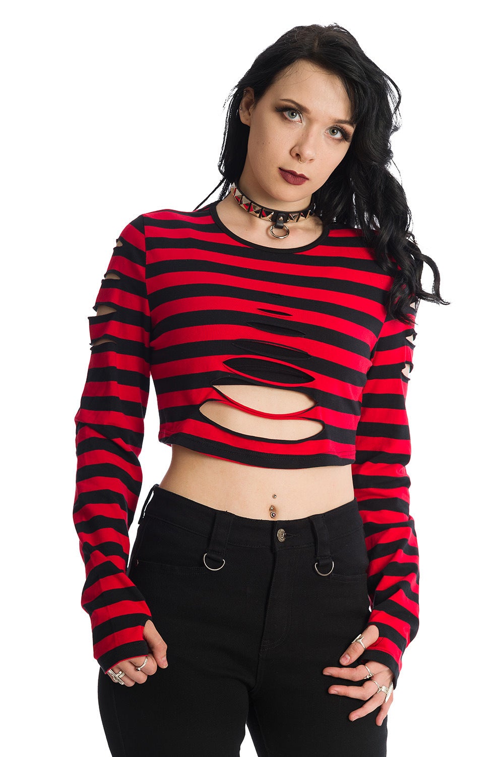 Alternative model in long sleeved crop top with ripped details in black and red stripe 
