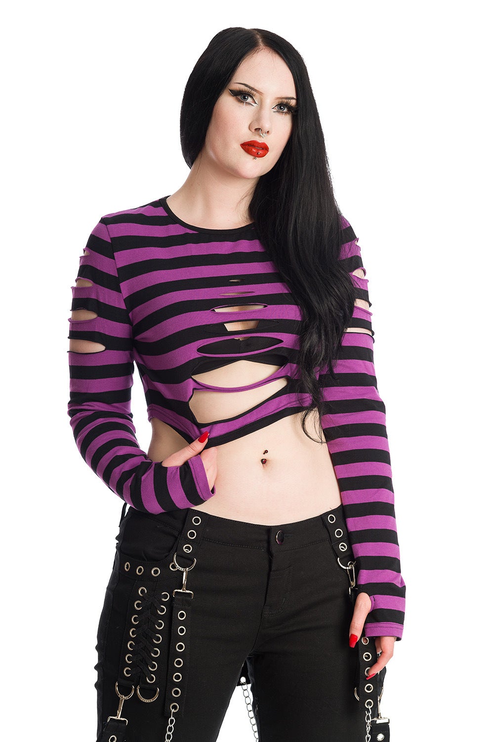 Alternative model in long sleeved crop top with ripped details in black and purple stripe 