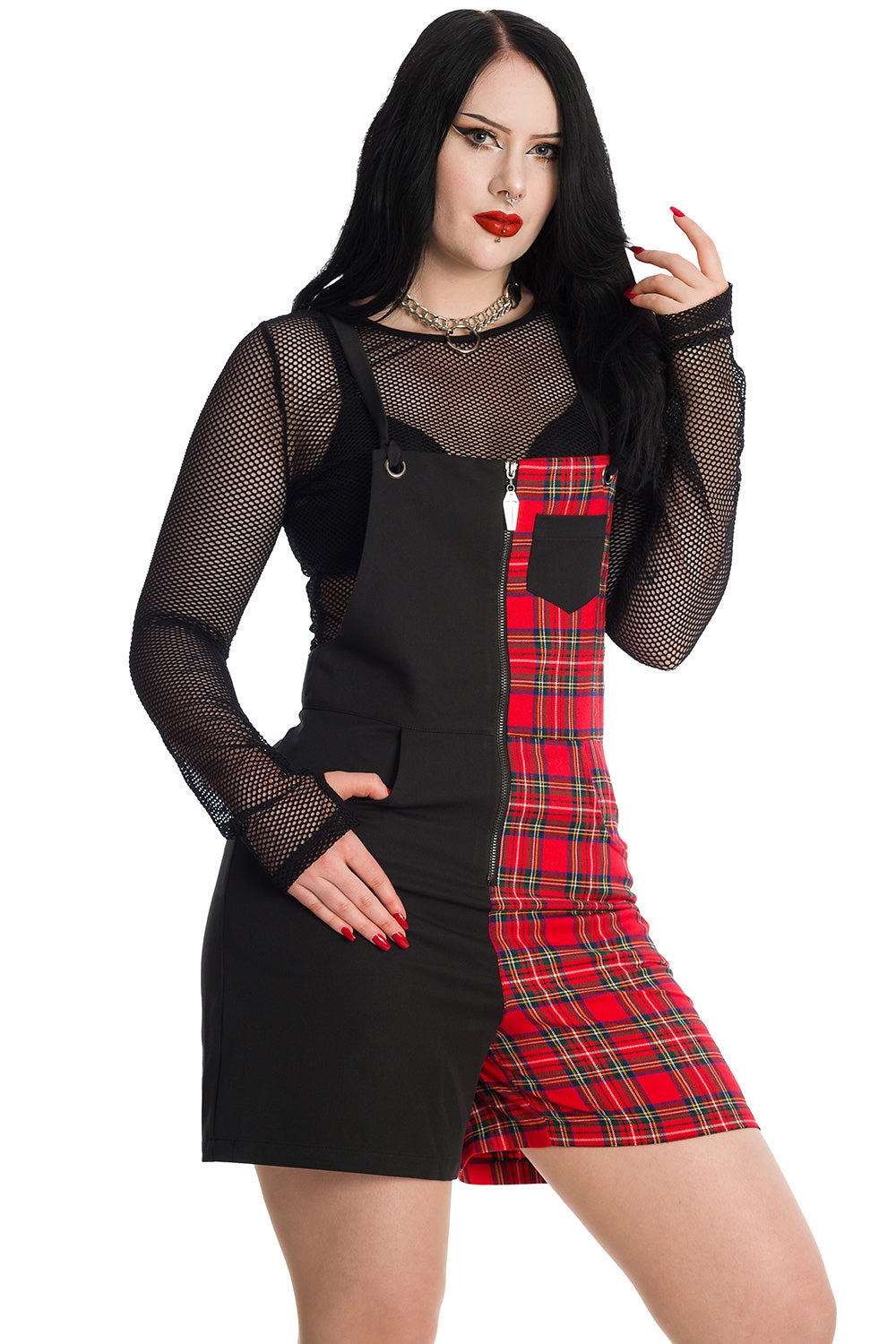 Alternative model wearing half black and half red tartan print dungarees with mesh crop top underneath