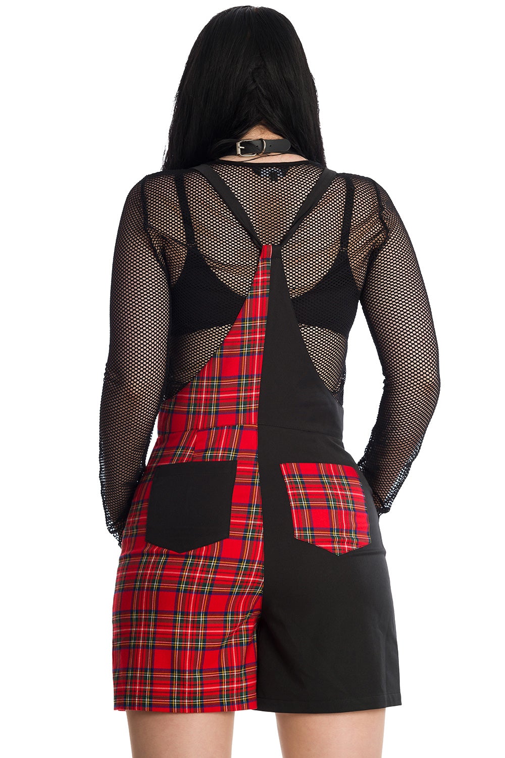 Alternative model wearing half black and half red tartan print dungarees with mesh crop top underneath