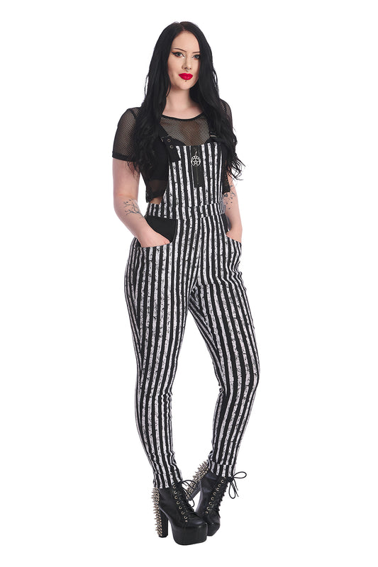 Alternative model in black and white striped dungarees with short sleeved black crop top underneath.  