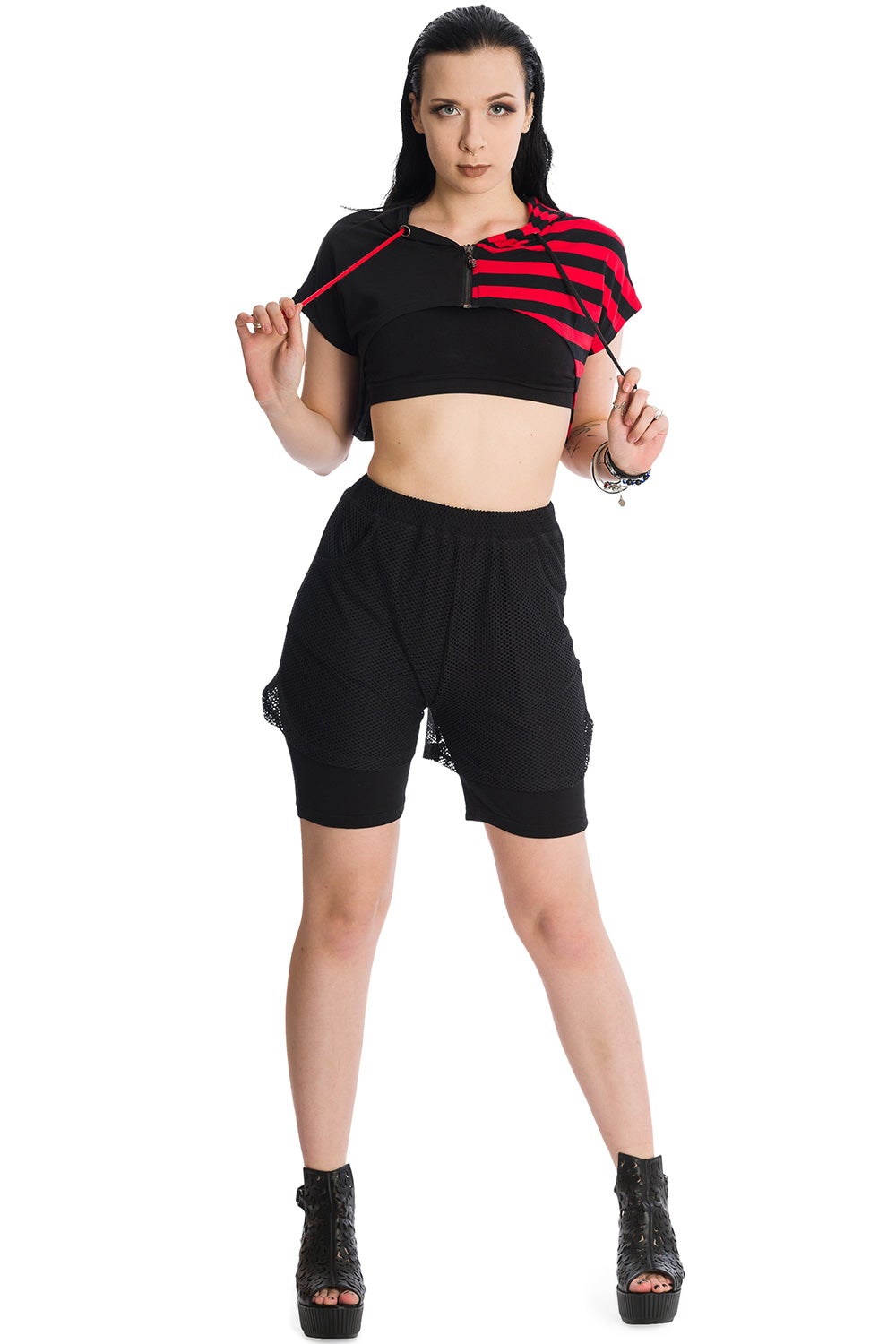 Alternative model in cropped half red strip and half black hoodie and black shorts.