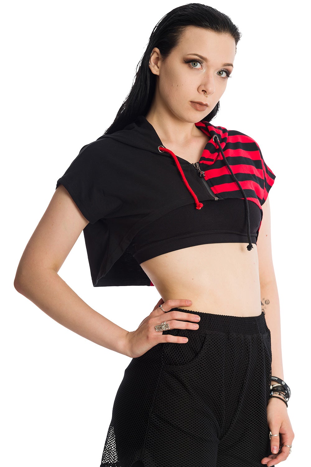 Alternative model in cropped half red strip and half black hoodie