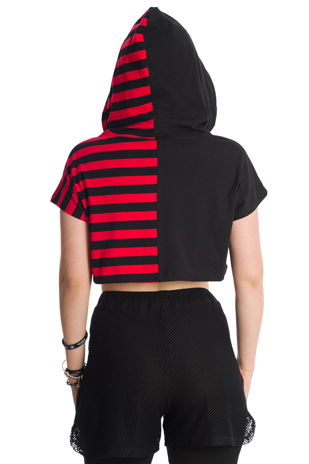 Alternative model in cropped half red strip and half black hoodie with hood up.