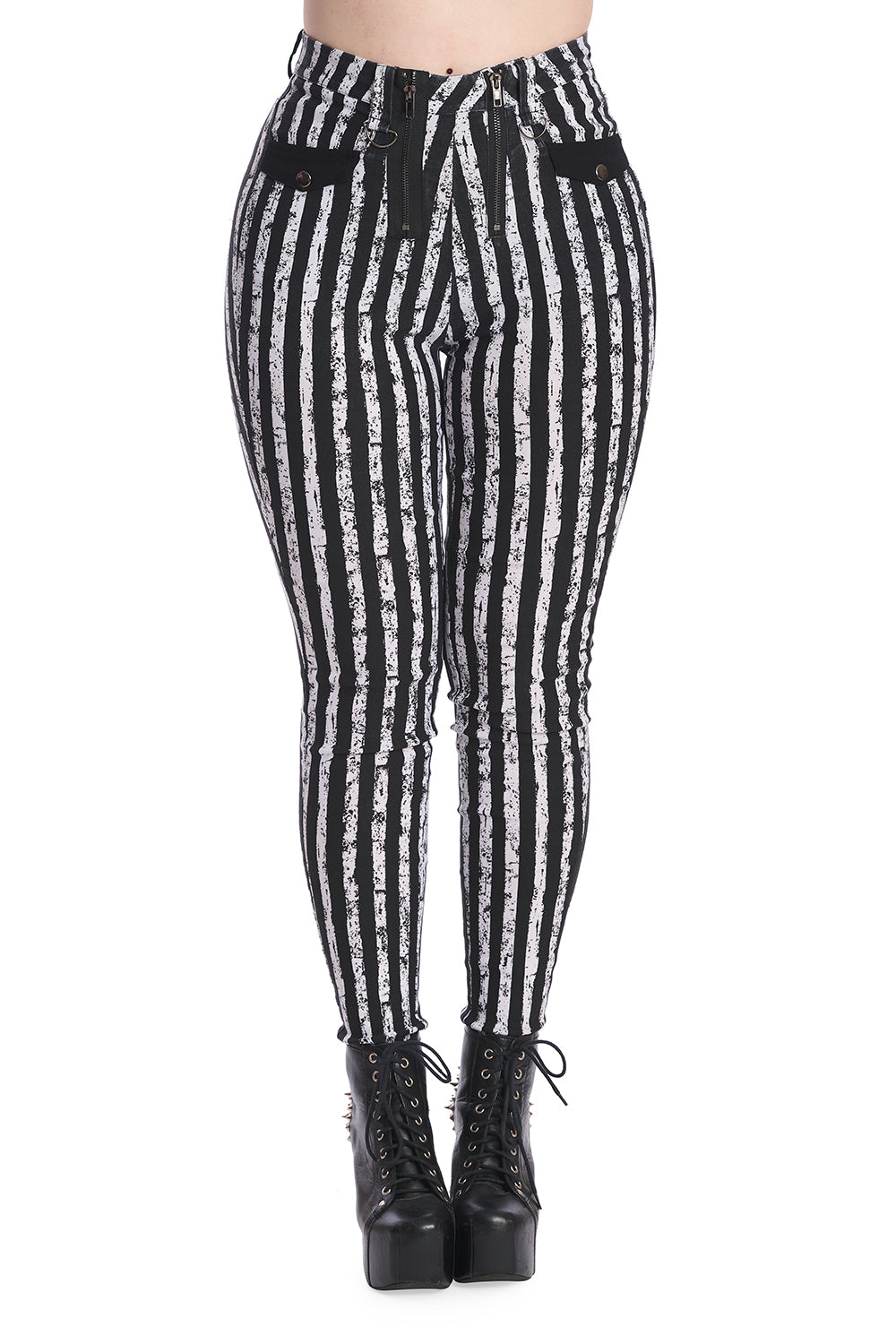Alternative model in mesh black crop top with high waisted black and white striped skinny legged trousers with distressed colour. 
